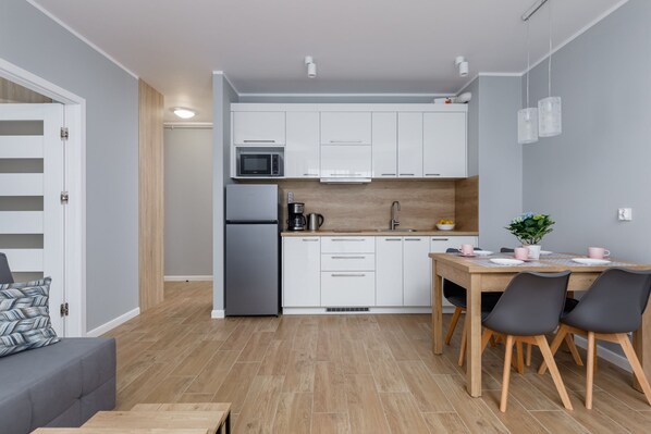Fridge, microwave, stovetop, coffee/tea maker