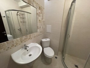 Shower, towels, soap, toilet paper