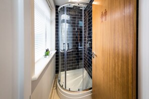Shower, slippers, towels, soap