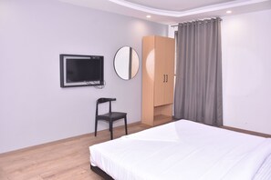 Standard Room | Living area | 32-inch LED TV with cable channels, TV - Chhavi Hotels (Noida)