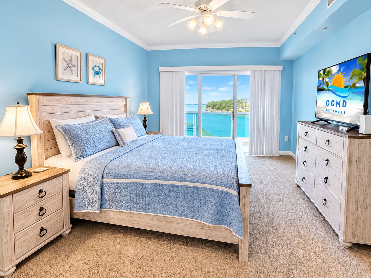 A bedroom with a bed, nightstands, a dresser, and a television.