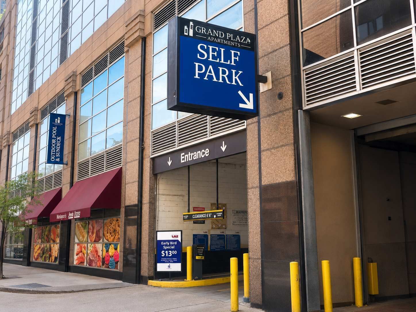 A building with a sign for 'Grand Plaza Self Park' and an entrance.