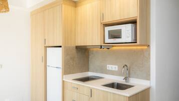 Fridge, microwave, stovetop, coffee/tea maker