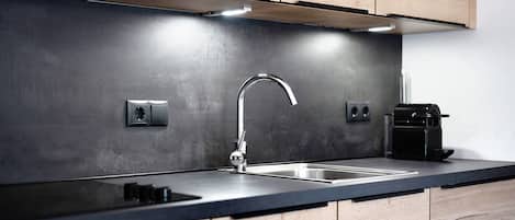 Fridge, stovetop, dishwasher, coffee/tea maker