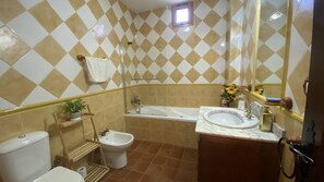 Bathtub, hair dryer, towels