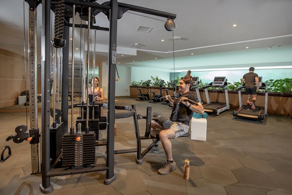 Stay fit and active in our well-equipped gym featuring cable machines and treadmills.