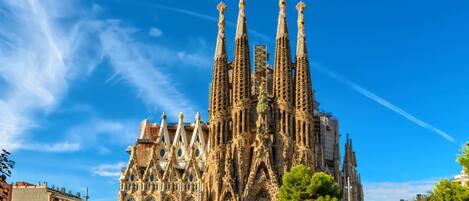 A historic building with intricate Gothic architecture, featuring multiple spires and ornate details.