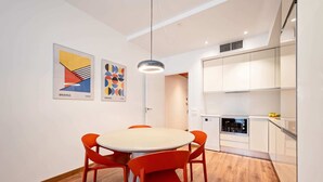 A modern kitchen with white cabinets and a built-in oven. - Sweett | Bailen 404 - Two Bedroom Apartment, Sleeps 4 (Barcelona)