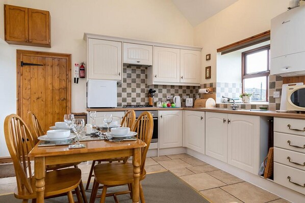 Fridge, microwave, cookware/dishes/utensils