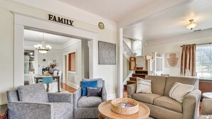 A living room with grey and beige sofas, a wooden coffee table, and a chandelier. - Walk to Crown Zellerbach Trl: PNW 'Celestial Inn' (Scappoose)