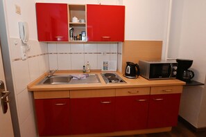 Fridge, microwave, stovetop, coffee/tea maker