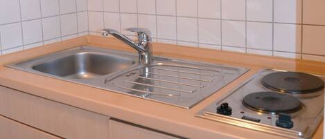 Fridge, stovetop, coffee/tea maker, toaster