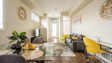 Premium Townhome, 1 Bedroom, Kitchen, City View | Living area | 43-inch flat-screen TV with cable channels, TV, Netflix