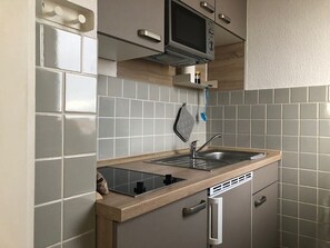Fridge, microwave, stovetop, coffee/tea maker
