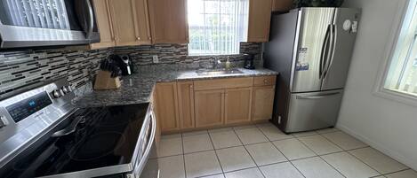 Fridge, microwave, stovetop, coffee/tea maker