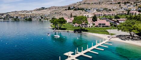 Enjoy serene lakeside views from the marina and surrounding buildings.