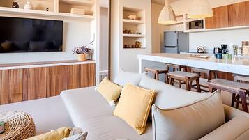 Apartment | Living area | 65-inch flat-screen TV with cable channels, TV