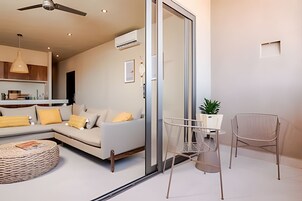 65-inch flat-screen TV with cable channels, TV