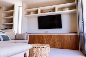 Apartment | Living area | 65-inch flat-screen TV with cable channels, TV