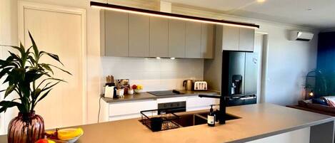 Coffee/tea maker, fridge, microwave, oven