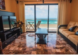 Premium Apartment, 2 Bedrooms, Beach View, Oceanfront | Living area | 60-cm Smart TV with cable channels, Netflix, streaming services