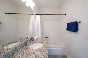 Bathtub, hair dryer, towels