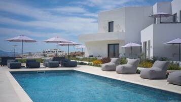 Seasonal outdoor pool, pool umbrellas, pool loungers