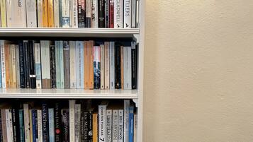 A bookshelf filled with various books.