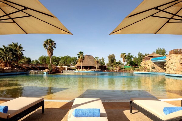 Indoor pool, seasonal outdoor pool, pool umbrellas, pool loungers