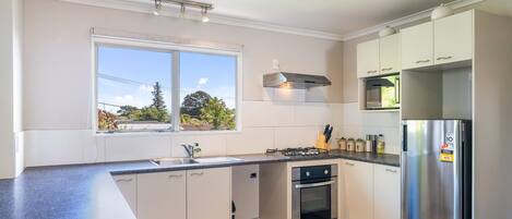 Fridge, microwave, toaster, cookware/dishes/utensils