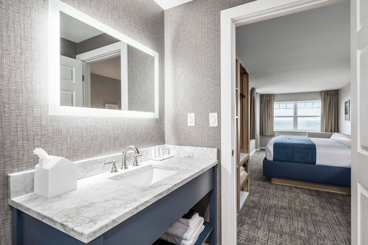 lakeview corner king room | bathroom | designer toiletries, hair dryer, towels, soap