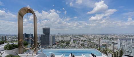 Outdoor pool, pool umbrellas, sun loungers