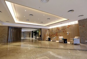A modern lobby with a polished marble floor, recessed lighting, and contemporary furniture. - Cset Hotel Changzhou (Changzhou)