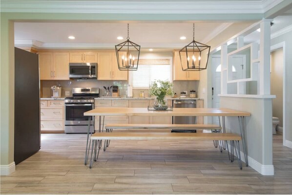 Enjoy cooking in this well-equipped kitchen with a large island and stainless steel appliances.