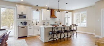 Lakeside retreat with grill, fireplace, W/D, AC & sunset views - dog-friendly