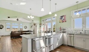 Enjoy meal preparation and dining in this well-equipped kitchen with a central island and ample counter space.