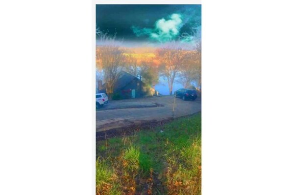A residential area with houses and parked cars. - Camp Run-A-Muk (Savannah)