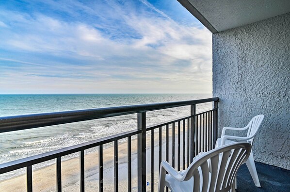 A balcony with a view of the beach and ocean. - Oceanfront Balcony: Resort Condo in Myrtle Beach (Myrtle Beach)