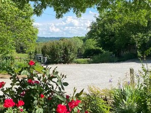 Escape to a serene natural haven surrounded by lush greenery and vibrant flowers.