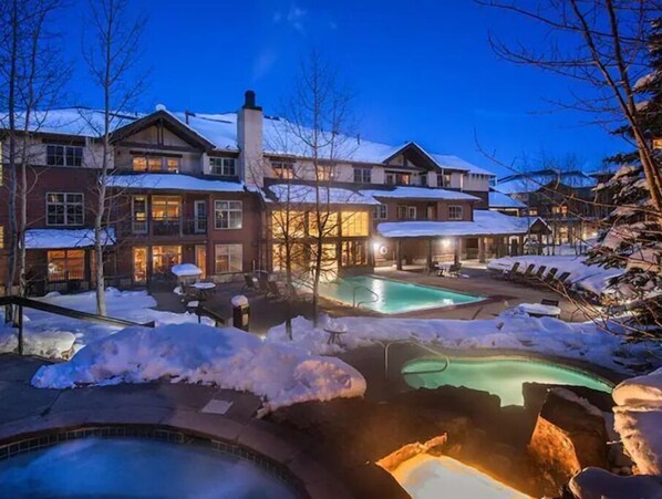 Guests can enjoy multiple outdoor pools surrounded by snow.