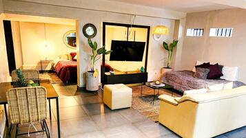 Deluxe Apartment | Living area | 40-inch LED TV with digital channels, TV