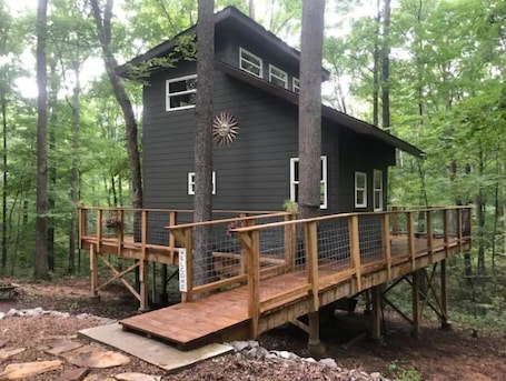 Exterior. Secluded treehouse with indoor fireplace