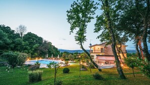 A two-story house with a swimming pool, surrounded by lush greenery and a view of the mountains. - Beautiful home in Grubine (Grubine)