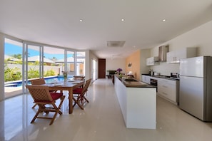 Standard Villa | Private kitchen | Electric kettle, cookware/dishes/utensils, dining tables