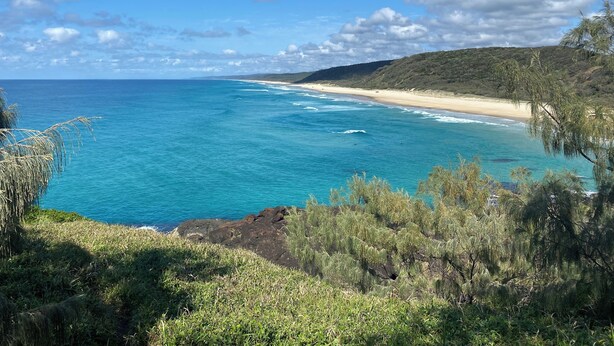 A coastal landscape with a beach, ocean, and vegetation. - Peaceful Oasis at Cooloola Cove (Cooloola Cove)