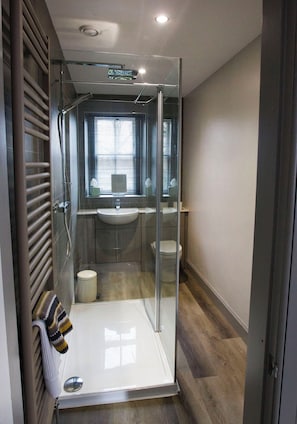 Shower, hair dryer, towels, soap
