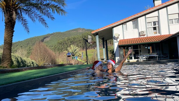 A pool area with a view of a house and palm trees. - MARKAIDA HOUSE WITH POOL (Mungia)