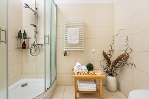 Shower, hair dryer, towels, soap