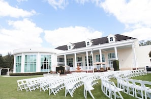 Stunning building with a central patio area, large windows, and a covered entrance.