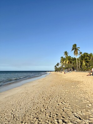 On the beach, sun-loungers, beach towels